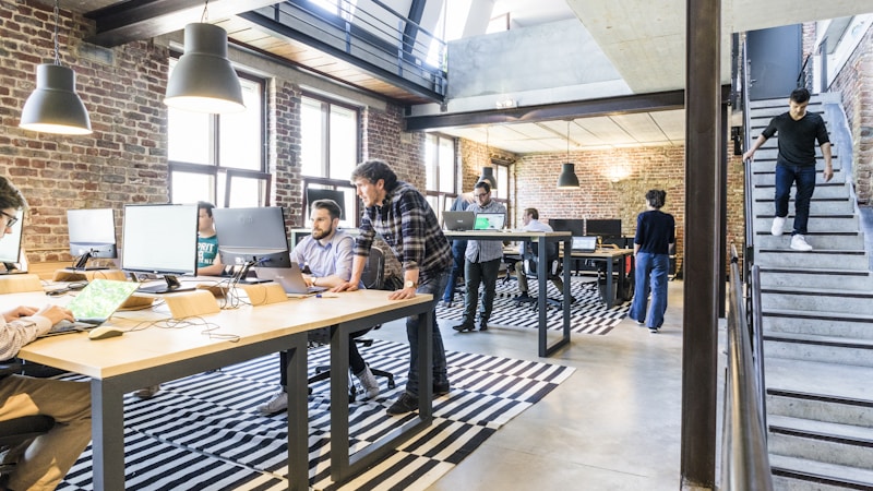Single person looking at mountain peak, representing the gap between solo capability and massive scale